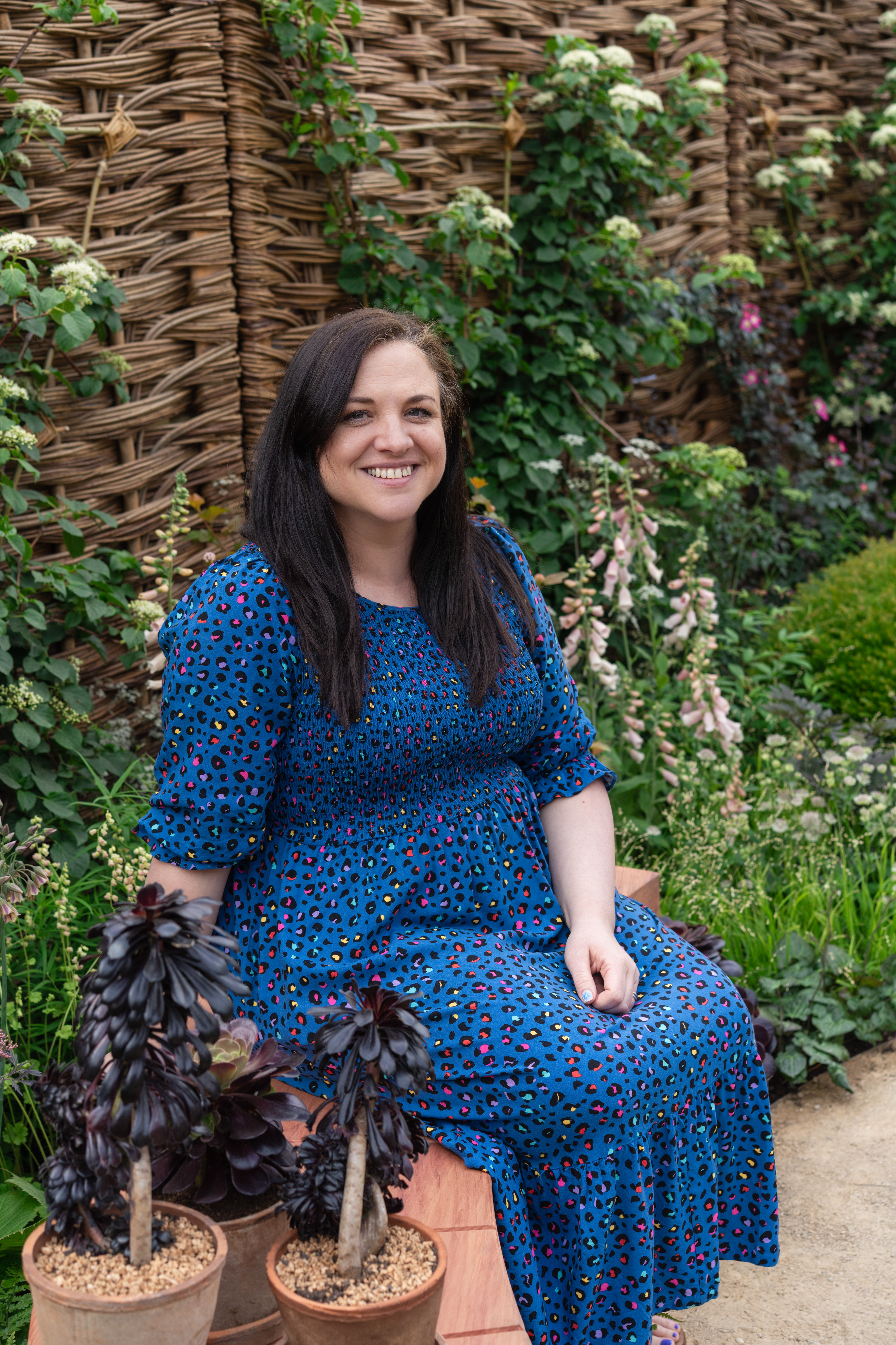 A close up shot of Lindsey Roberts (interim CEO at the ADHD Foundation) smiling in the garden